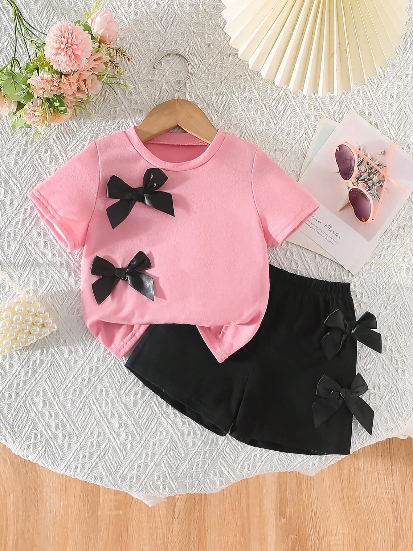 SHEIN 2pcs Toddler Girls Light Pink Summer Birthday Outfit,Fashion Sweet Round Neck Short Sleeve Cropped T-Shirt With 3D Bow Decor&Elastic Waist Shorts Set
