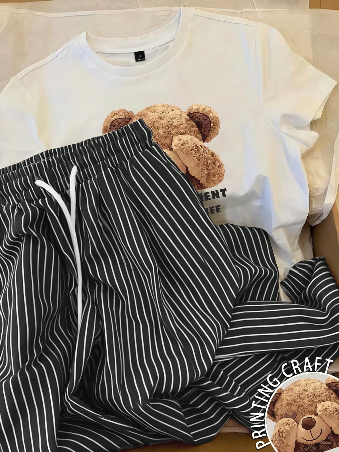 Resyla 2pcs Women Printed Round Neck Short Sleeve Top And Striped Pants Set