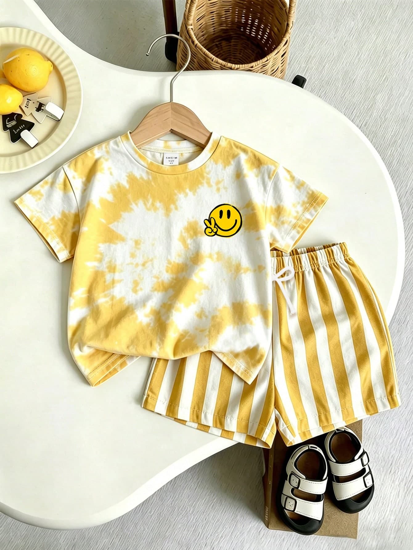SHEIN Playful Pals 2pcs/Set Young Boy Summer Vacation Tie-Dye Full Print T-Shirt With Face & Striped Shorts, Soft Stretchy Fabric, Loose Fit, Casual Comfortable Outfit, Suitable For Outdoor, Street, Home, Travel, Vacation, Daily Wear