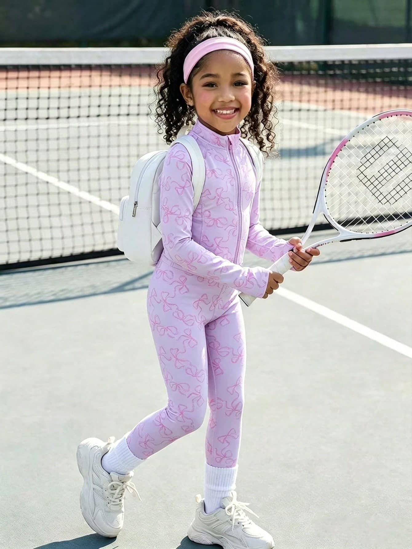 This Cute Pink Printed Jacket And Pants Set For Young Girlis Made From Soft, Stretchy Fabric For All-Day Comfort. Perfect For Playgrounds, Outings, And Casual Wear, It's A Stylish And Practical Choice For Active Young Girl Throughout The Year