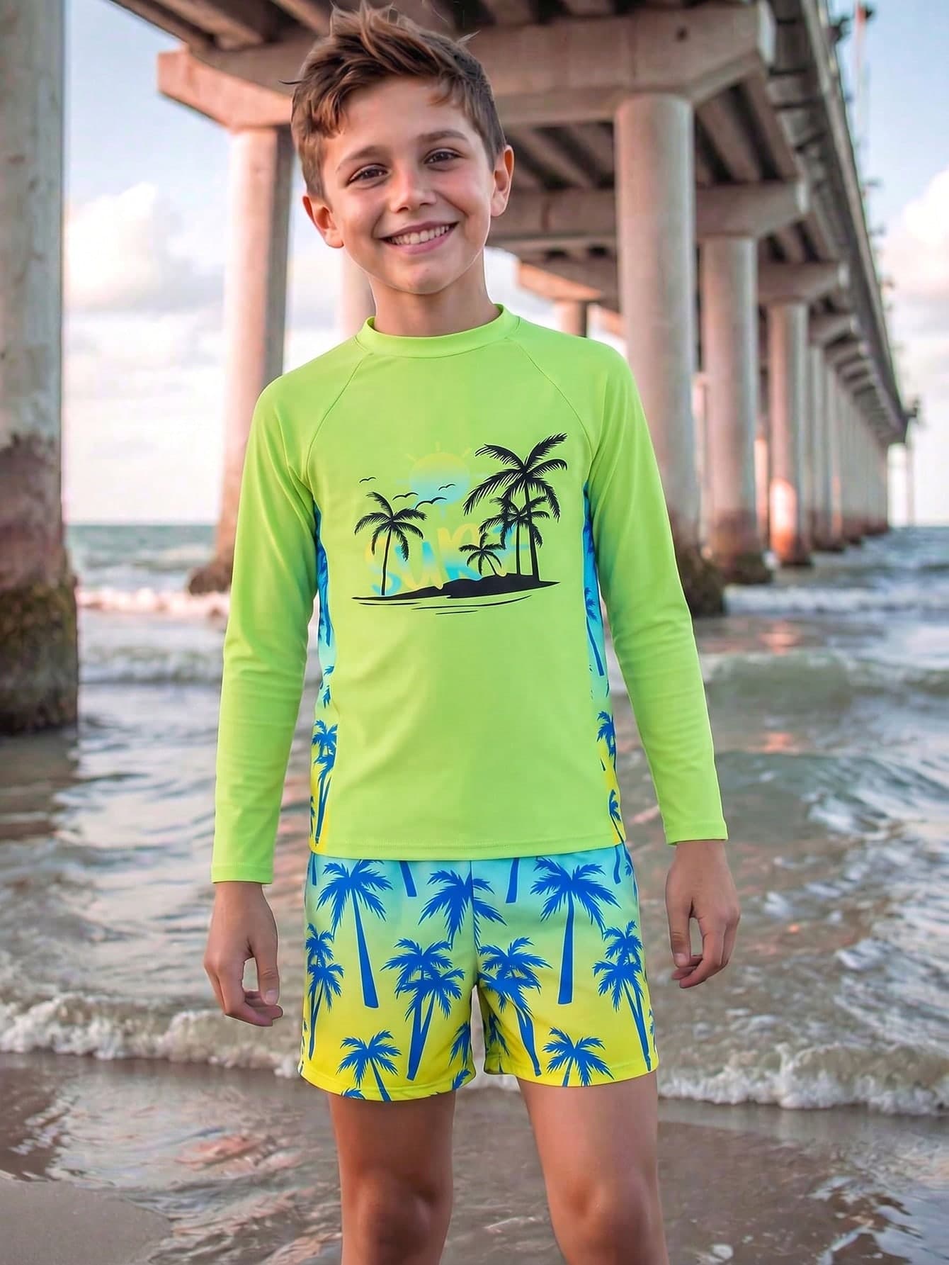 SHEIN Tween Boys Swimwear Vibrant Surf Style, Main Body In Eye-Catching Neon Green With Black Palm Tree, Sun, And Seagull Island Silhouette Print On Chest, Side Panels With Blue-Yellow Gradient Palm Tree Print, Round Neck Long Sleeve Cut, Pants With Blue-Yellow Gradient Base Color And Matching Blue Palm Tree Print, 2-Piece Set, Fashionable, Casual, Suitable For Swimming, Summer Vacation, Summer Beach And Seaside, Swimming Pool Summer Holiday Party Casual Vacation