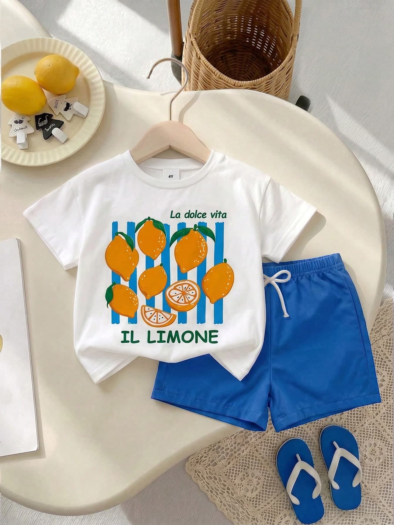 SHEIN Playful Pals 2pcs Boys Toddler T-Shirt Set, Fruit Stripe Pattern Cute Fashion Versatile Basic Pastoral Vacation Country Style Plaid Japanese And Korean Style 2-Piece Set, Boys Short Sleeve Round Neck Pullover T-Shirt And Elastic Waist Bow Decor Shorts Set, Boys Summer Vacation Set, Children's Clothing, Children's Beach Vacation Set, Tropical Vacation Set, Fruit , Stripe