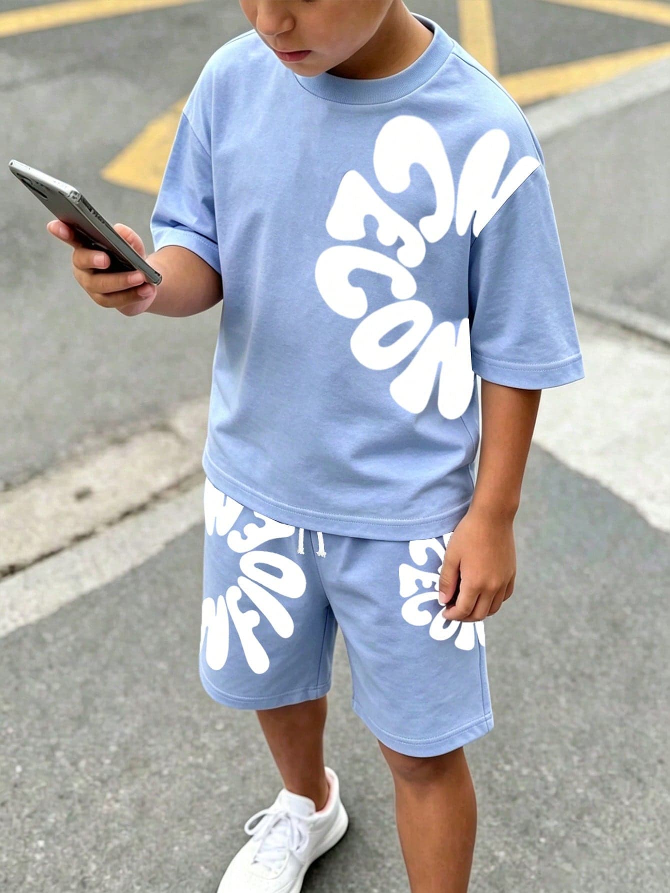 SHEIN Boys' (Big) T-Shirt Set, 2pcs/Set Summer Fashion Cool Cartoon Asymmetric Letter Print Short Sleeve Crew Neck T-Shirt, Paired With Matching Print Elastic Waist Shorts With Drawstring Decor, Soft Stretch Fabric, Loose Fit, Spring/Summer Fashion Boys' T-Shirt Set, Casual Comfortable Versatile, Suitable For Outings, Street Style