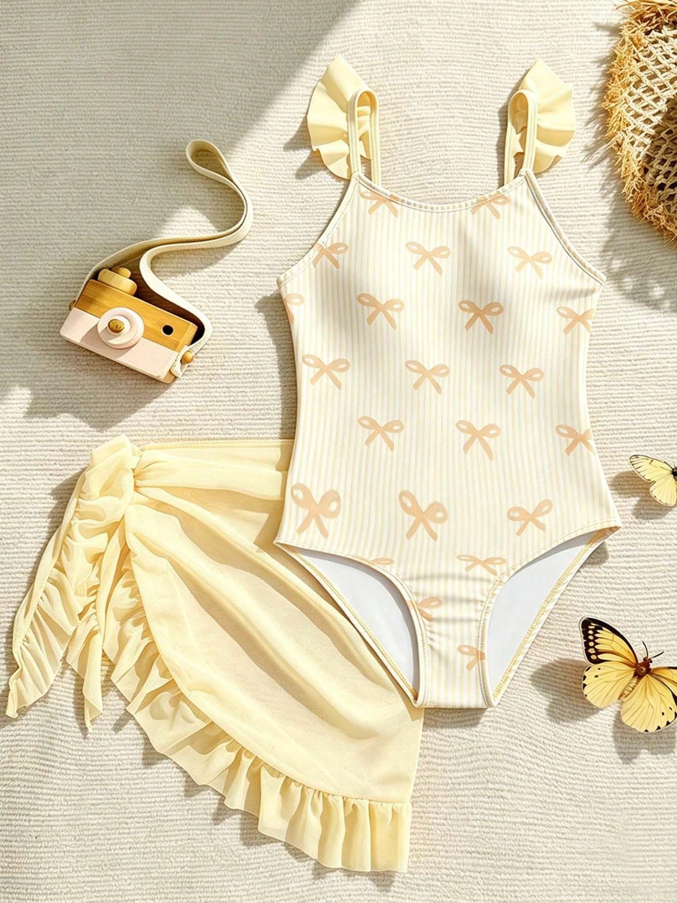 SHEIN Tween Girls Cute Bow Tie Print Shoulder Strap Floral Trim One-Piece Swimsuit With Ruffle Skirt, Suitable For Swimming, Vacation, Summer Beach