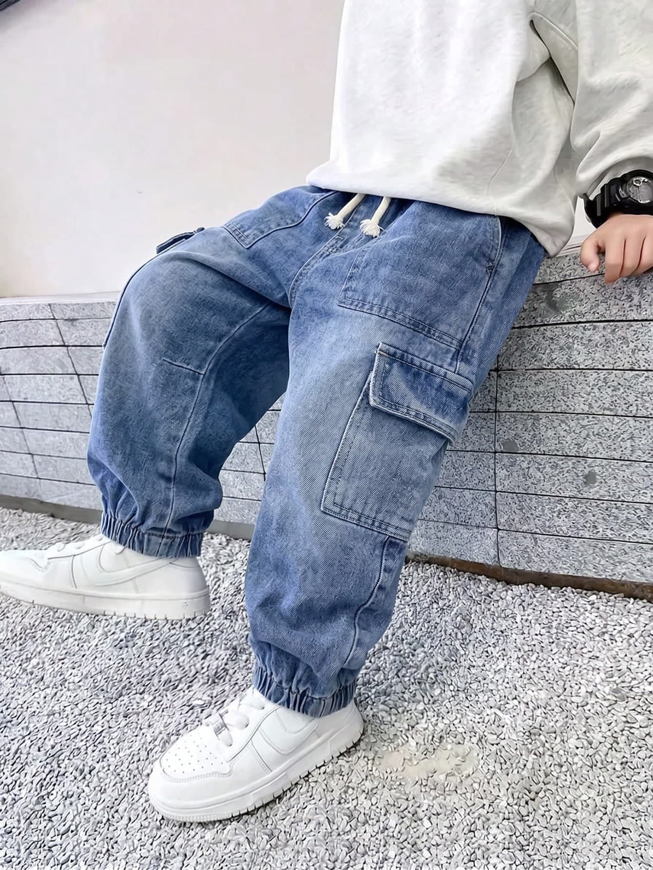SHEIN Mirajuku Young Boy Cargo Cuffed Denim Jeans, All-Season Versatile Street Casual Retro Style, Medium Blue Washed Denim, Bowknot Decoration, Double Side Large Cargo Pockets, Washed Distressed Craftsmanship, Loose Cuffed Fit, Soft Skin-Friendly Denim Fabric, Can Be Paired With T-Shirts And Sweatshirts For Daily Wear, School, Outings, And Everyday Travel, Popular Denim Pants
