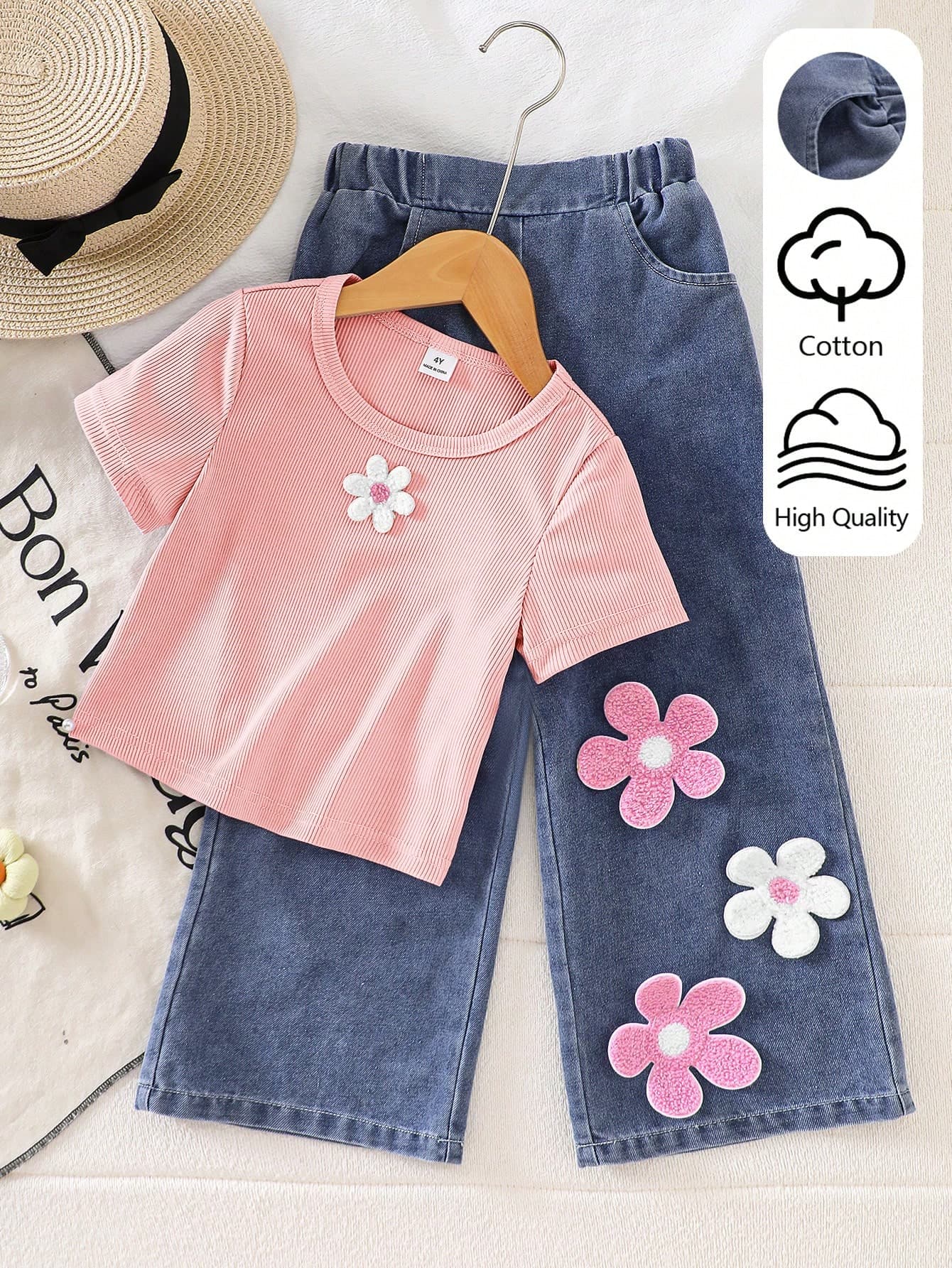 SHEIN Playful Pals Young Girls' New Cute Playful Short Sleeve T-Shirt + Denim Jeans 2-Piece Set, Knit Fabric Light Purple Crew Neck Short Sleeve T-Shirt With Fresh White Floral Applique On Front, Paired With Washed Blue Denim Long Pants Decorated With Purple And White Floral Applique, Soft And Comfortable Fabric, Effortlessly Wear American Casual Style, Suitable For Young Girls' Cute Playful, Casual Minimalist, Comfortable Commute Outfits, Perfect For Daily School, Outdoor Play, Weekend Outings, Combining Comfort And Fashion