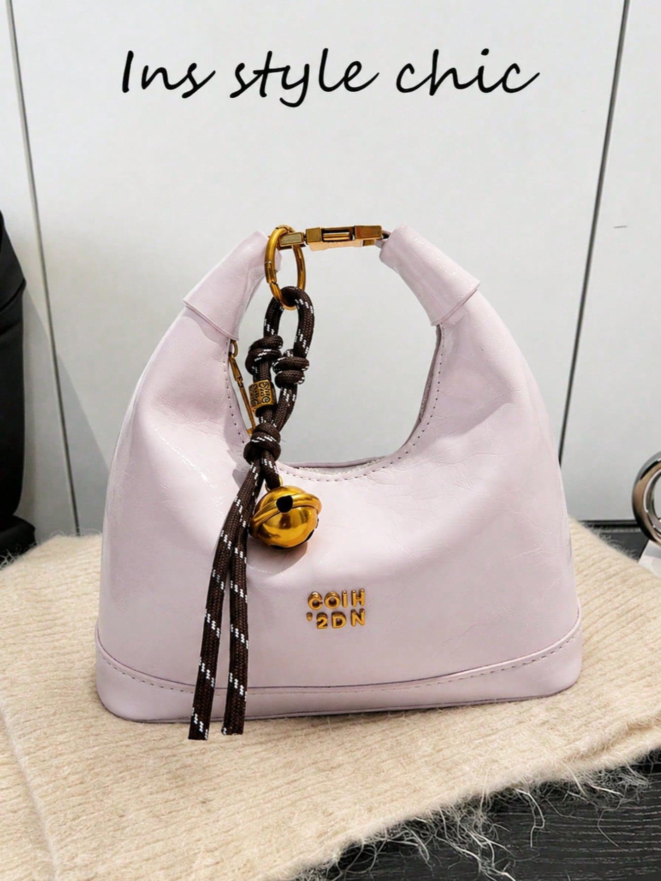 Fashionable Pale Pink Glossy Hollow Handbag With Metal Letter Print, Woven Rope Bell Pendant And Zipper, Suitable For Dating, Daily Use And Shopping