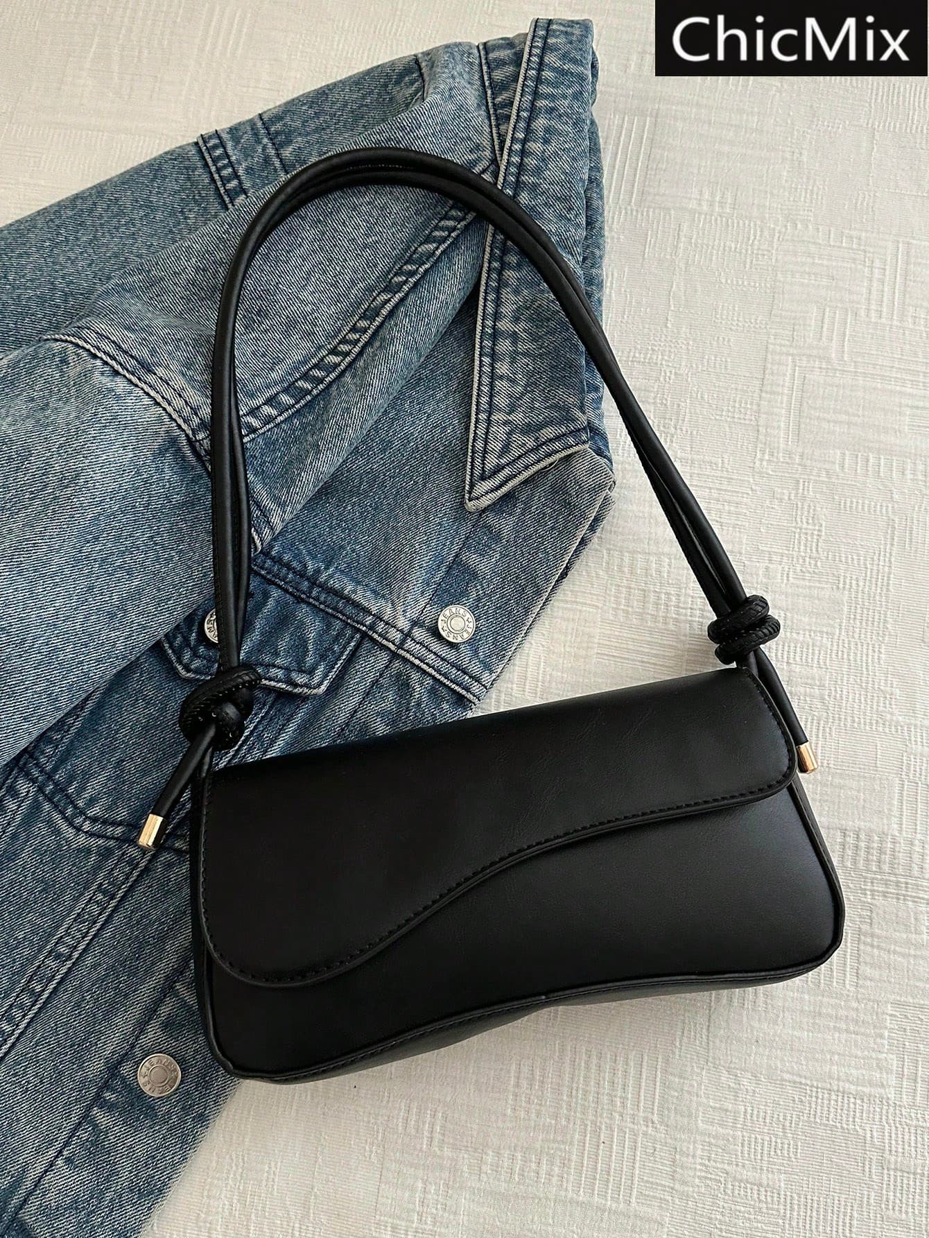 Fashionable And Minimalist Bag Features An Asymmetric Flap Design And An Adjustable Shoulder Strap