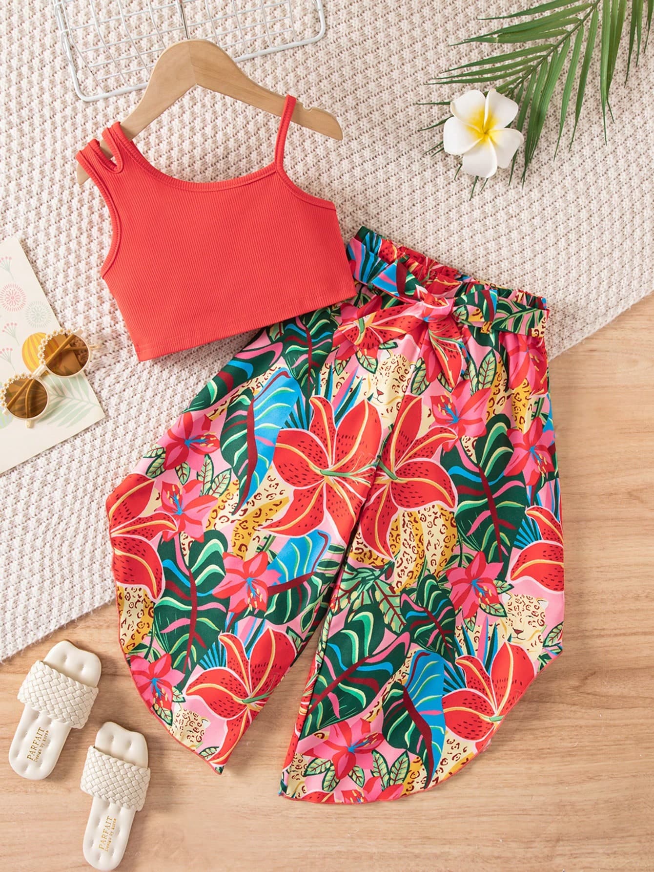 SHEIN 2pcs/Set Girls' Chic Outfit Summer Beach Holiday,Red Asymmetric Spaghetti Strap Cropped Tank & Tropical Floral Leopard Wide Leg Pants With Bow Tie