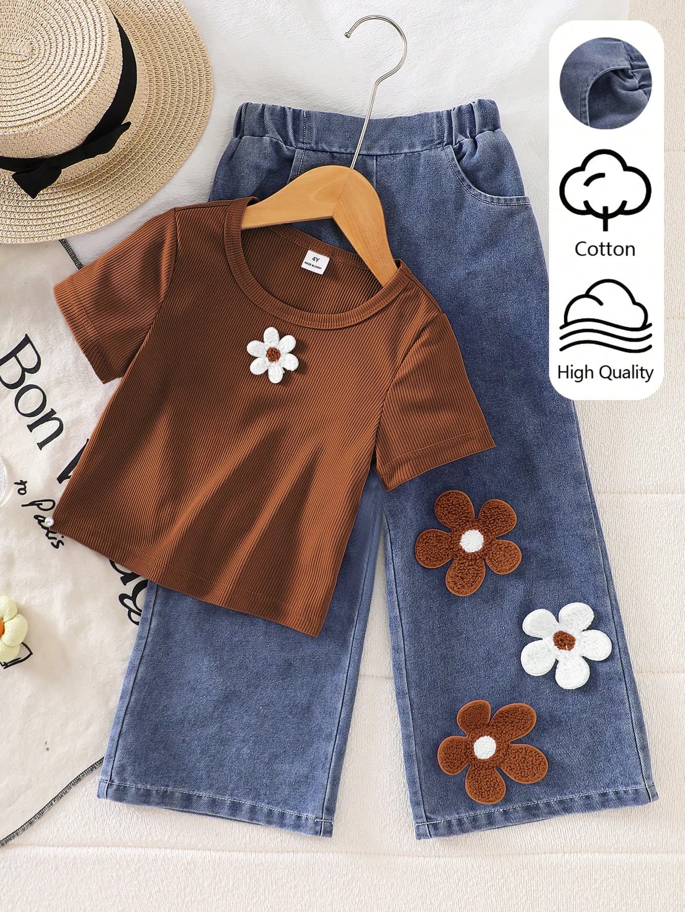 SHEIN Playful Pals New Cute & Playful 2-Piece Set For Toddler Girls: Brown Knit Crew Neck Short Sleeve T-Shirt With Fresh White Floral Patch Detail + Washed Blue Denim Jeans, Casual Minimalist Outfit For Daily School And Weekend Outings, Comfortable And Fashionable