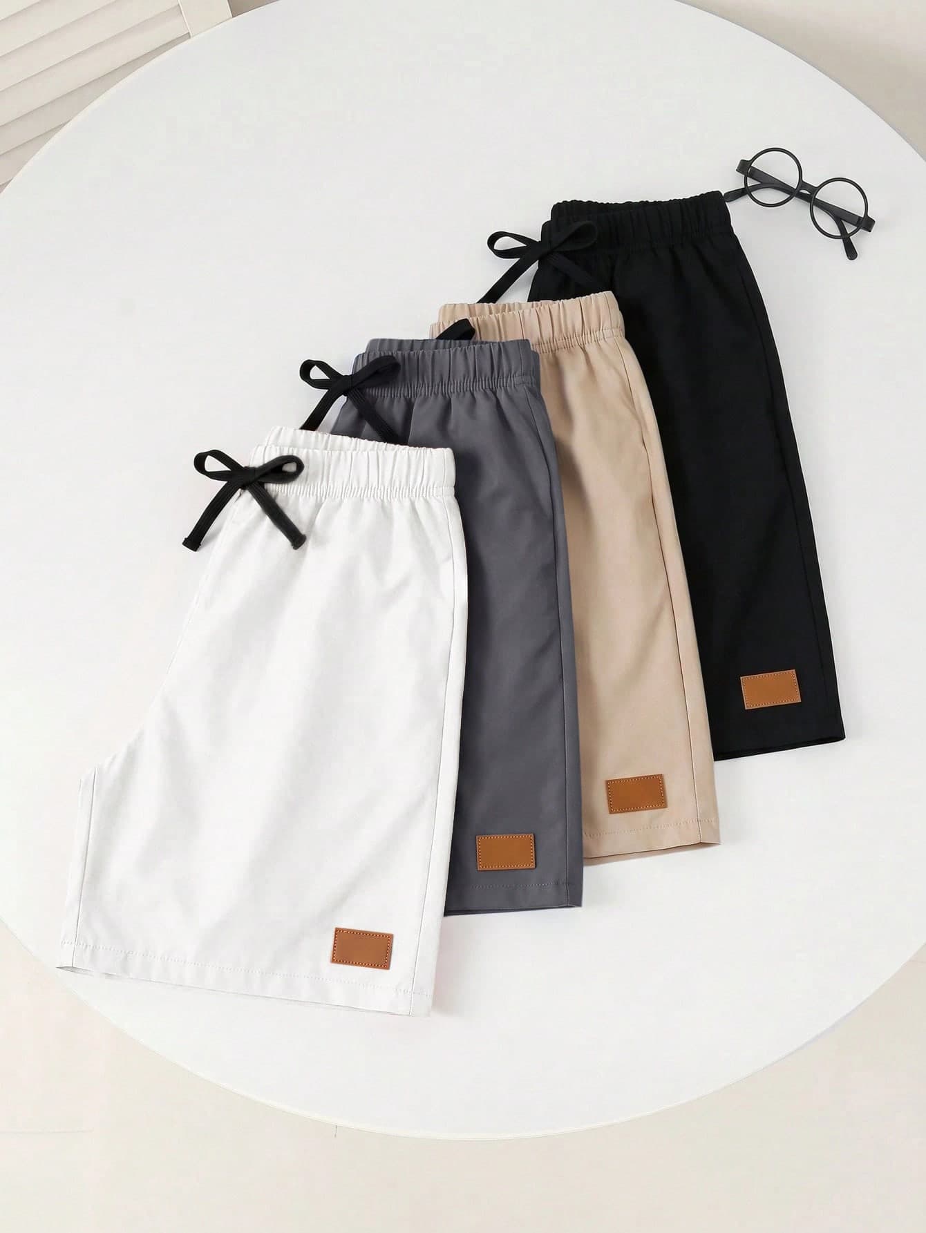 SHEIN 4pcs Kids Young Boy Casual Daily Versatile Comfortable Blue Khaki Black Orange Solid Color Woven Shorts With Patch Label And Drawstring Waist, Multi-Pack, Suitable For Commuting, School, Daily Casual, Vacation, Travel, Sports, Spring, Summer, Fall, Winter