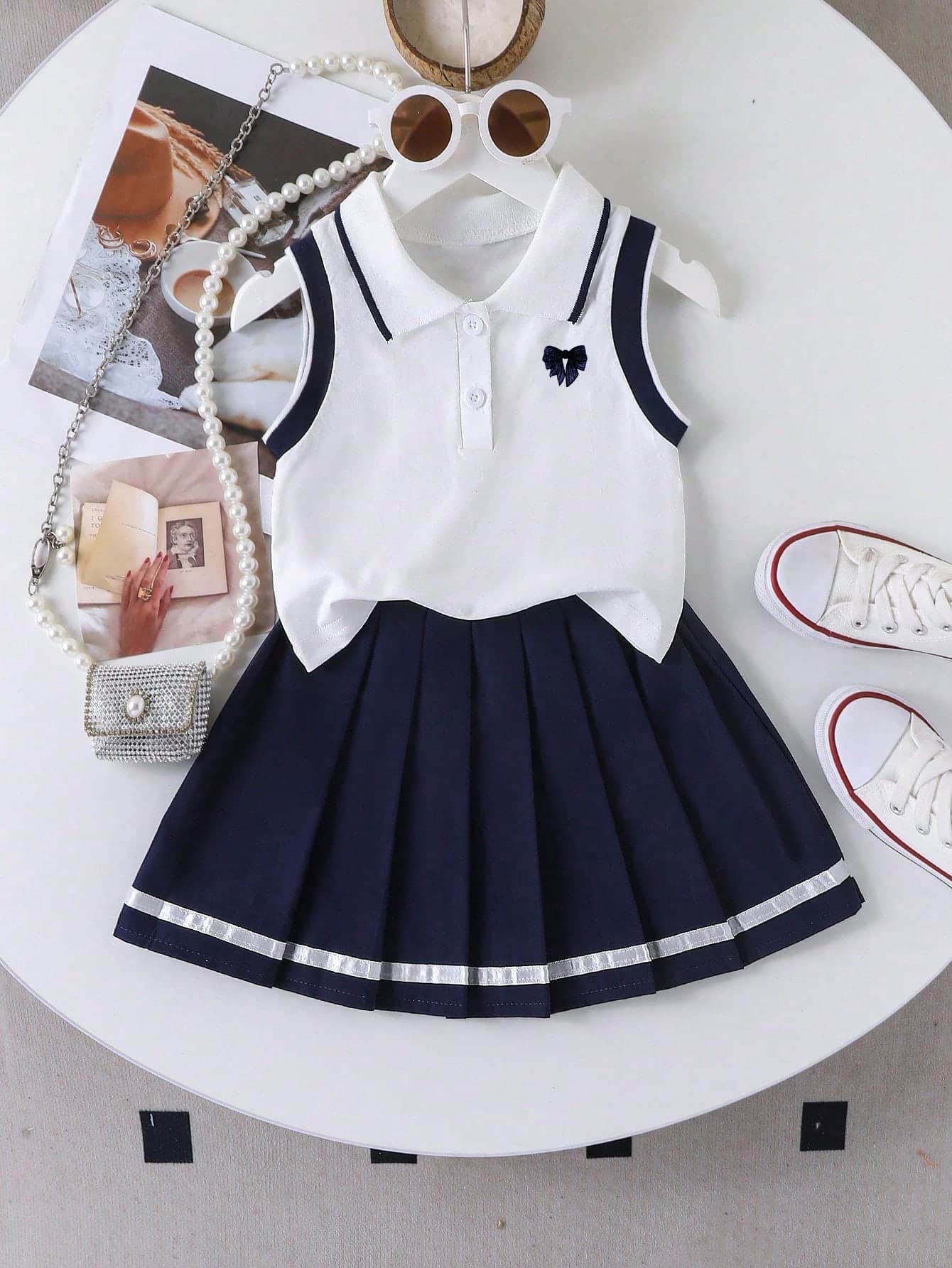 Young Girl Bow Print Polo Shirt And Pleated Skirt Set